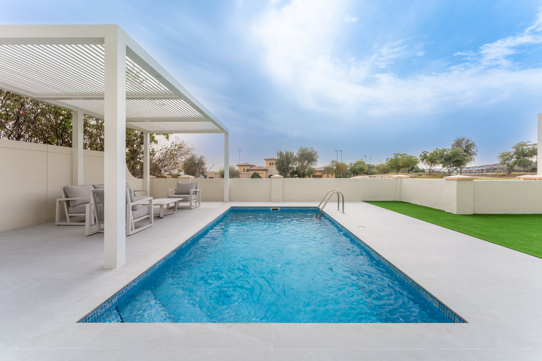 Private swimming pool and pergola built in a Dubai villa garden